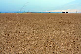 Landscape view of a dirt field and sky