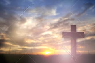 Silhouette of Jesus with Cross over sunset concept for religion, worship, Christmas, Easter, thanksgiving prayer and praise.â€¨