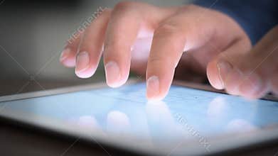 Hand touching screen on modern digital tablet pc.
