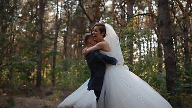 Bride and groom spinning in wedding dance