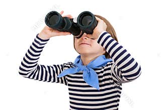 Young boy is looking through binoculars