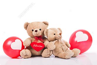 Teddy bear with red balloon
