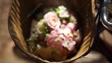 Basket with flowers in the sunshine