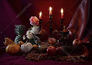 Still life with Fruits were placed together with candlestick