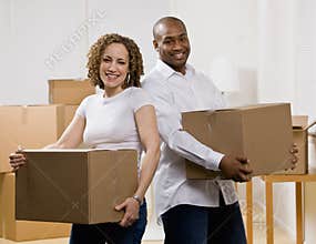 Happy couple moving into new home
