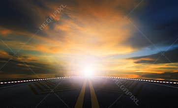 Sun rising sky and asphalt highway use as traveling and journey background