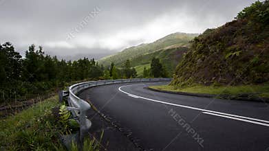 Mountain road turning to the right at the Azores Portugal