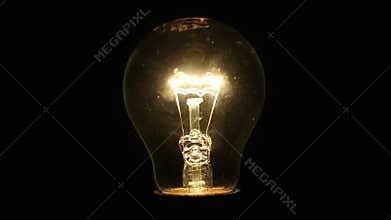 A light bulb illuminates a dark room, much like an idea in our mind