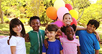 Group of kids standing together with arms around