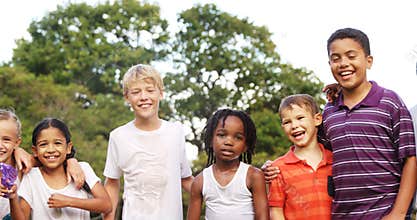 Group of kids standing together with arms around