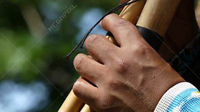 Native American artist playing flute