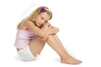 Pretty sad teenage girl sit on floor