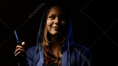 Criminal teen girl with a knife, young hooligan. 4K