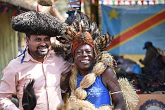 Men in traditional African Tribal dress, enjoying the fair