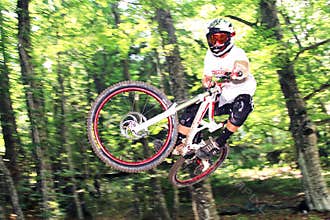 Downhiller during a jump