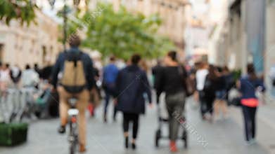 People walking on the street, not in focus