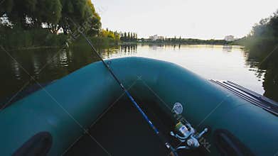Fishing on a lake from rubber boat. first-person view