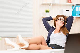 Despising conventions business woman relaxing in the office