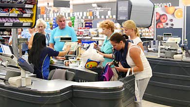 Customers paying for shopping at a supermarket. Line at the cash