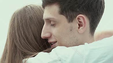 Beautiful girl thanks the guy and hugs him. Hug lovers.