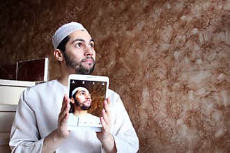 Selfie of arab muslim man wearing galabya