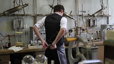 Man take off the lab coat after the chemical experiments