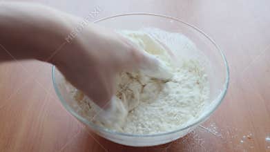 Put the flour in bowl and Hands mixing fresh dough