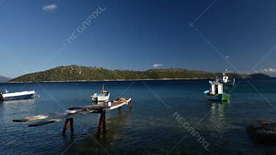 Fishing boats moored off coast, Kalamos, Island, Ionian Sea, Greece
