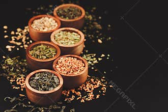 Assortment of dry tea in little bowls