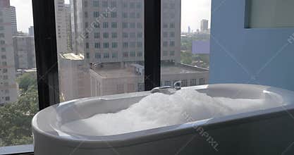 Bath falling with water and foam