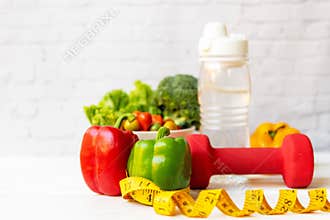 Diet Healthy food and lifestyle health concept. Sport exercise equipment workout and gym background