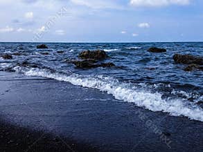 Exotic Rocky Beach Scenery And The Seawater Waves At Umeanyar Beach
