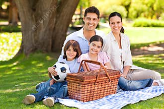 Happy family picnicking in the park