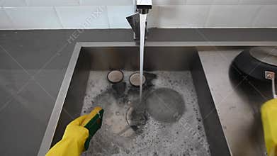 Point of view of person washing dishes