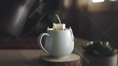 Coffee Drip at Home Concept. Pouring Hot Water from Kettle into a Dripper Bag. Making Hot Coffee Drink in Nature. Zen and Cozy