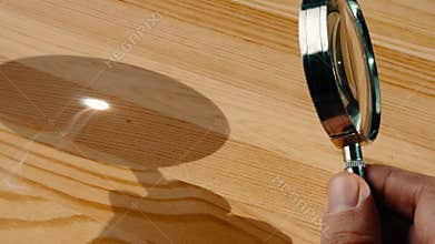 Using sunlight to burn with a magnifying glass.