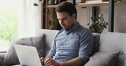 Guy use laptop received email bank loan approval feels happy