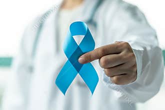 Prostate cancer blue awareness ribbon for men health in November with light blue bow color on medical doctor’s hand in clinical