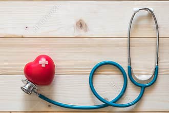 World health day campaign with red heart with cross bandage band-aid and medical doctor`s stethoscope, Cholesterol test