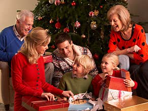 Three Generation Family Opening Christmas Gifts