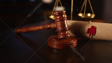 Close up of the Judge hitting Gavel off a block three times in courtroom.