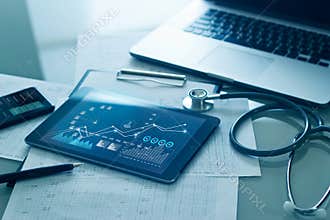 Healthcare business concept, Medical examination and graph data growth of business on tablet with doctor`s health report clipboard
