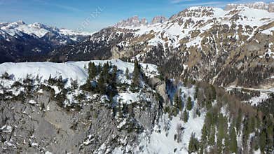 Aerial snow covered mountain peaks in alps at winter