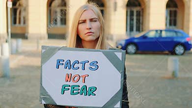 Facts not fear slogan on protest walk