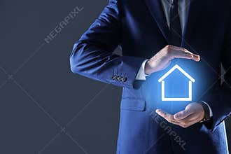 Property insurance concept. Man demonstrating house image
