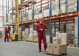 chain supply - two workers in storehouse