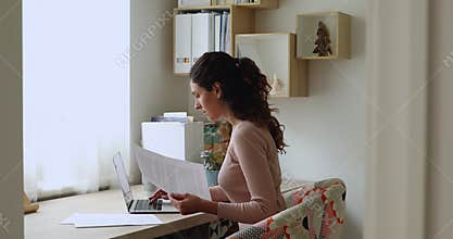Woman check loan papers pay online use laptop bank app