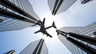 Jet plane flying over skyscrapers in business district - bottom view.