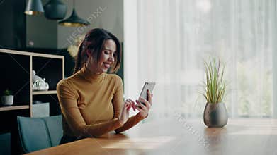 Pretty brunette woman take rest at her new apartment .