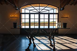 Window in Wine Cellar in Bordeaux with view to vineyards
